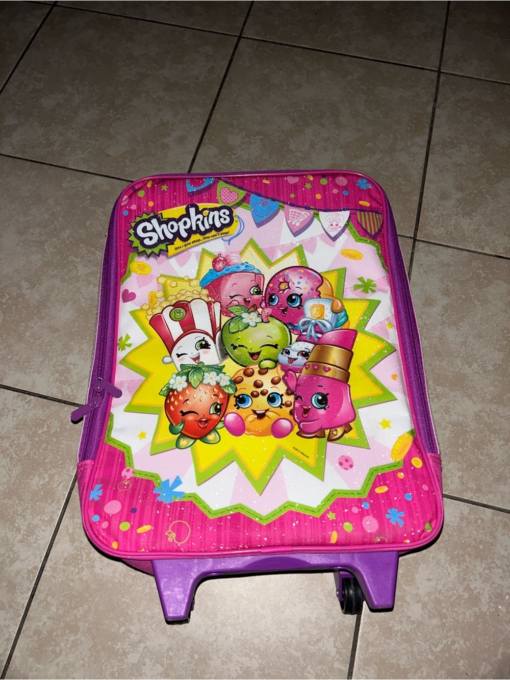 Pink Shopkins rolling suitcase